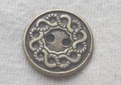Antique brass effect metal button