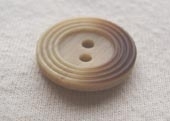 Varied dye ring button