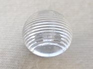 Domed clear shanked button.